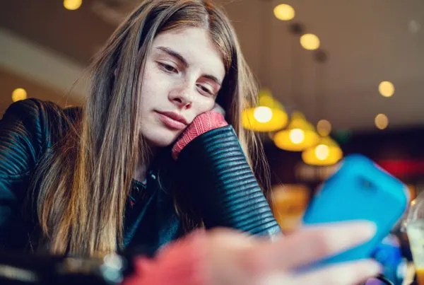 teen girl experiencing symptoms of xanax abuse at school