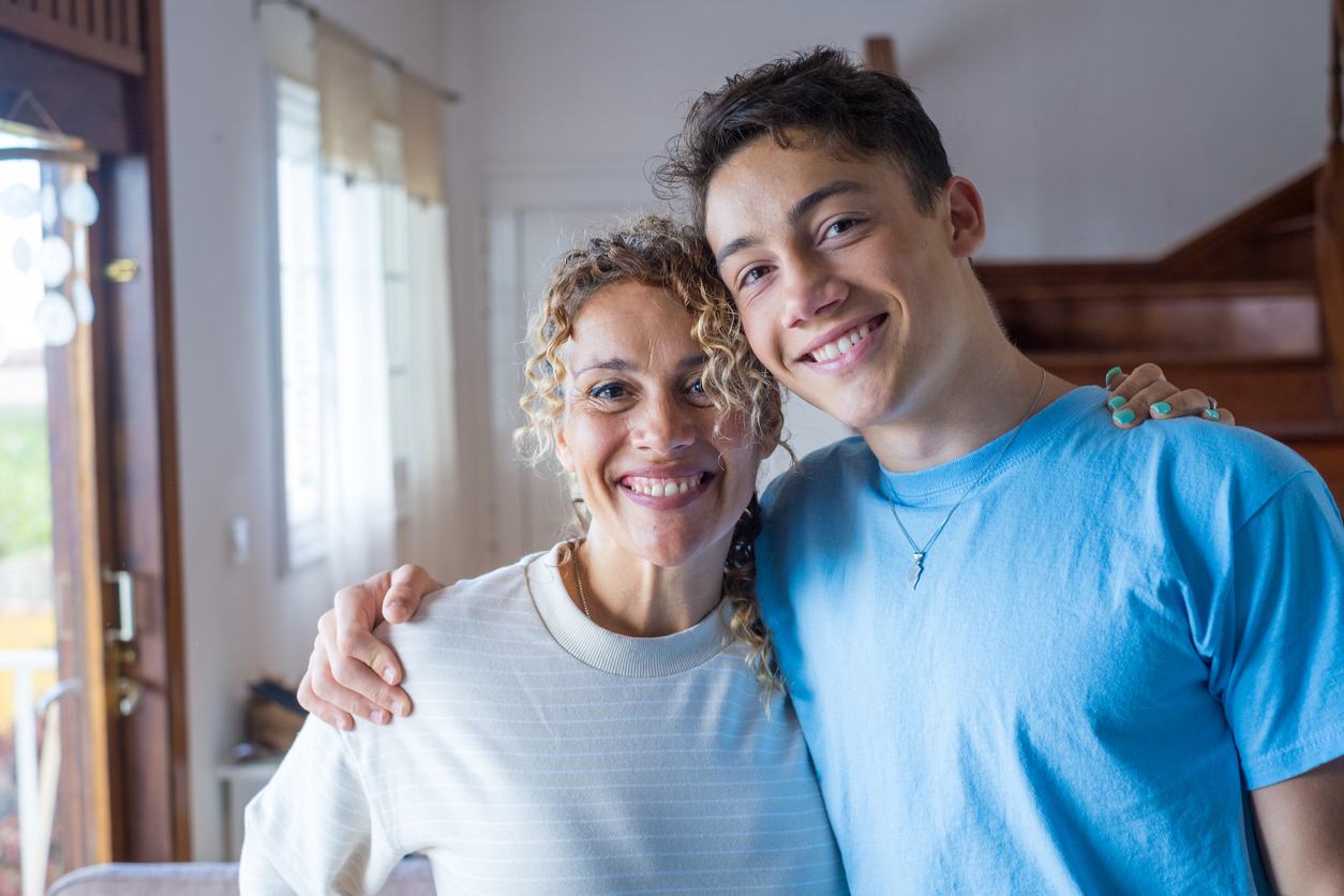 mom with teenage son, teaching him about teen health and wellness