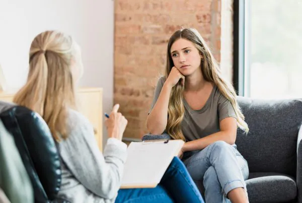 teen girl with counselor during clinical program at teen drug rehab