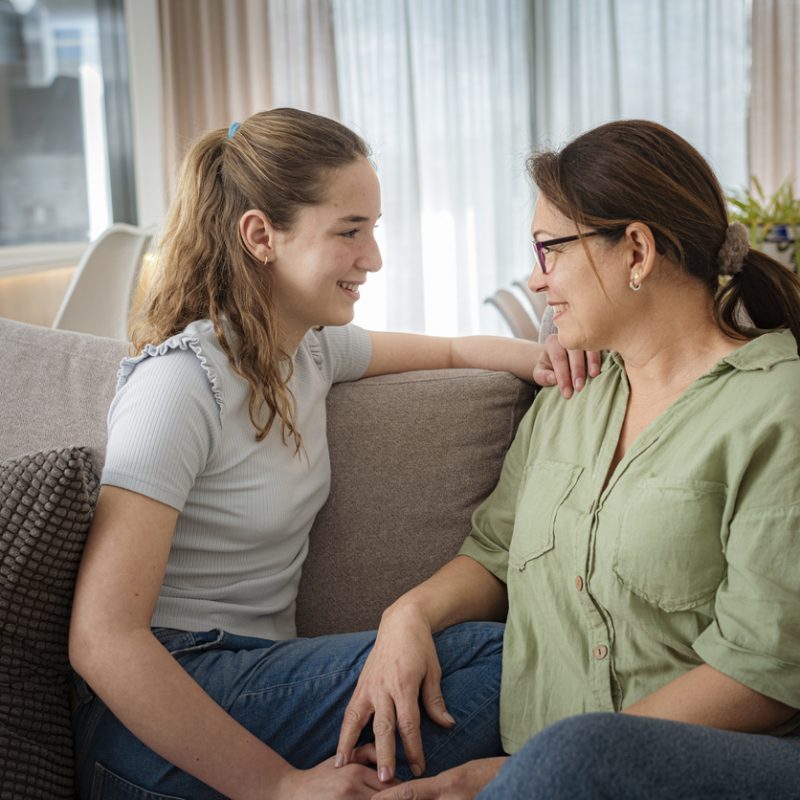 mother and teen daughter talking about teen mental health awareness